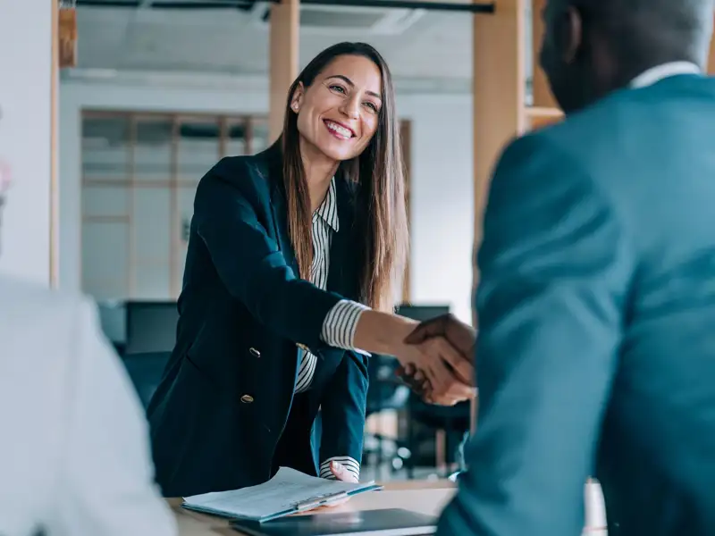 Coworkers shaking hands.